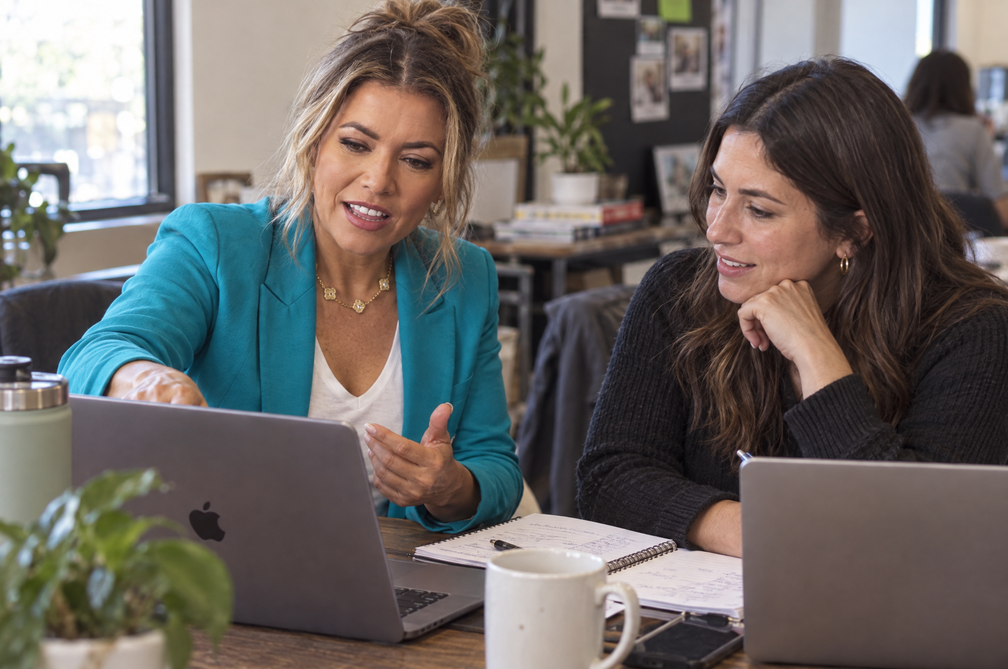 Julia Mann working through a client's business on a laptop