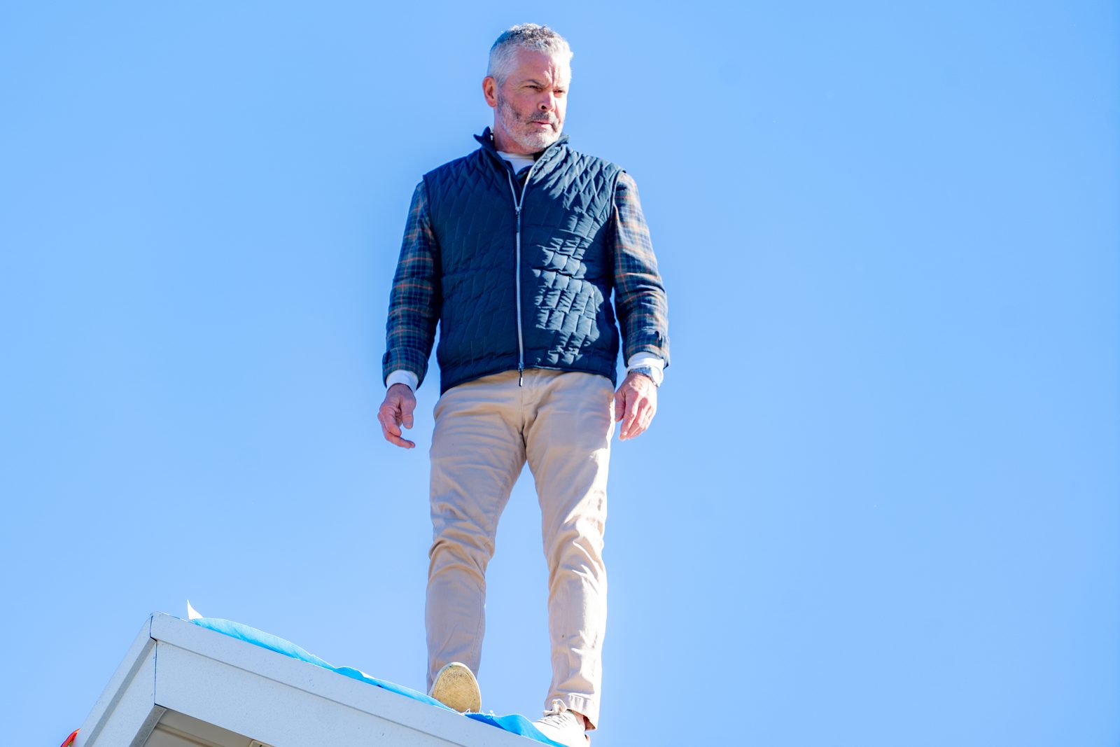 Tim Mallory, owner of Advantage Roofing, standing on a residential roof in Greater Cincinnati