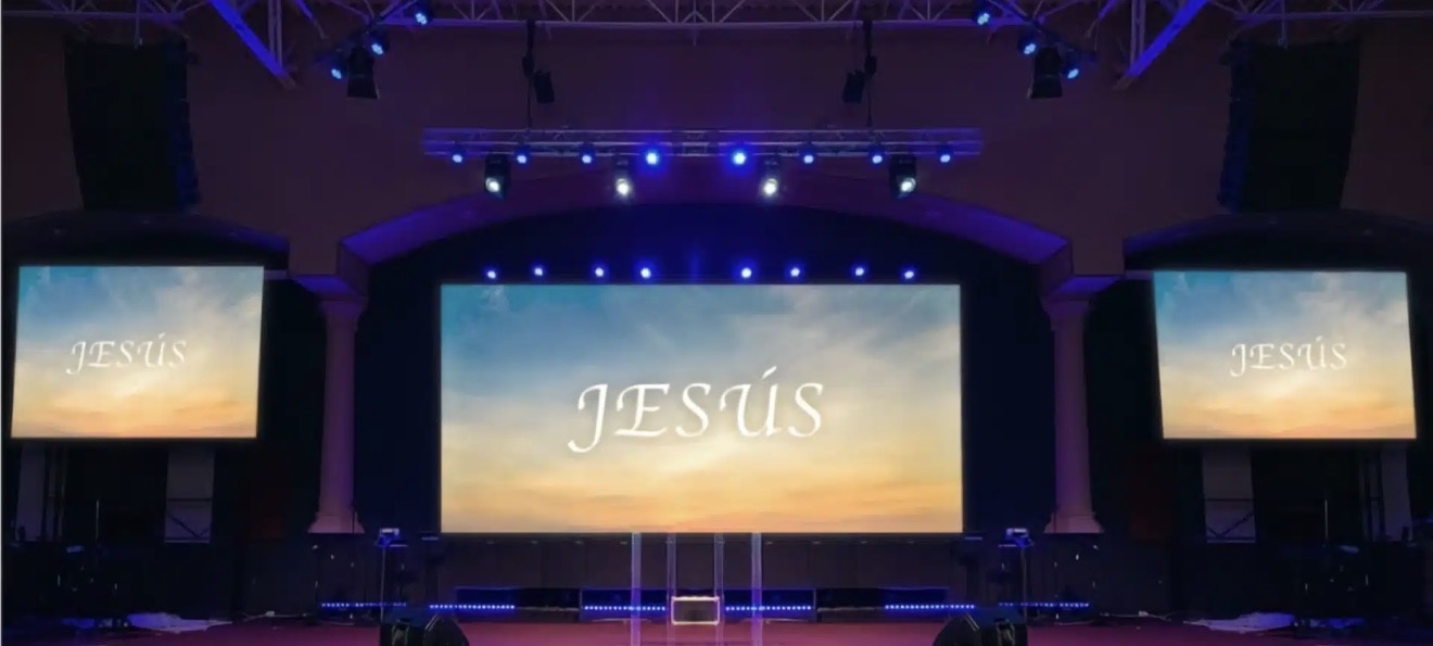 Church stage with a large LED wall and two side screens