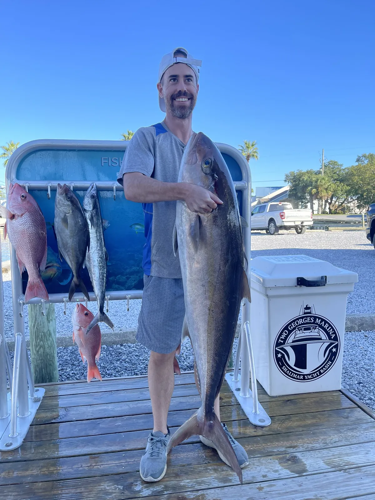 Young angler with a keeper snapper on a Catch 22 family charter