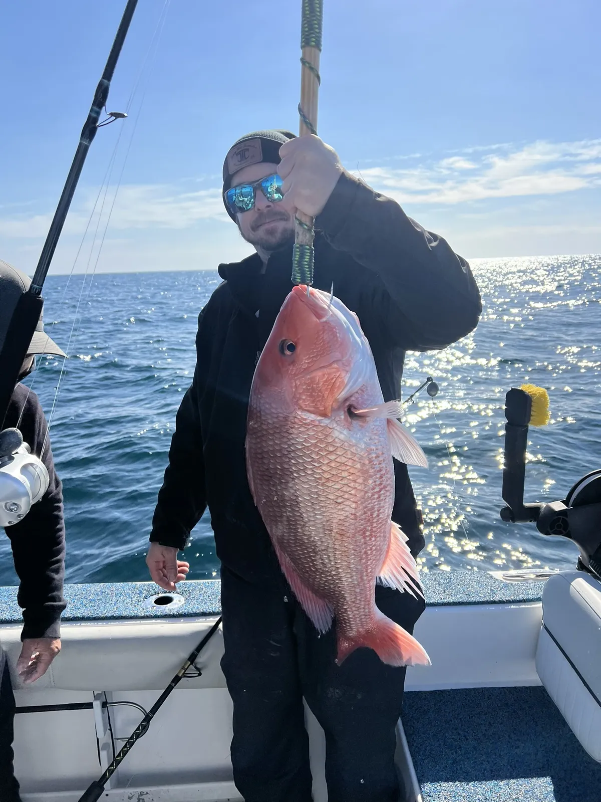 Angler fighting a fish on a Shimano reel aboard the Sea Fox 248 Commander