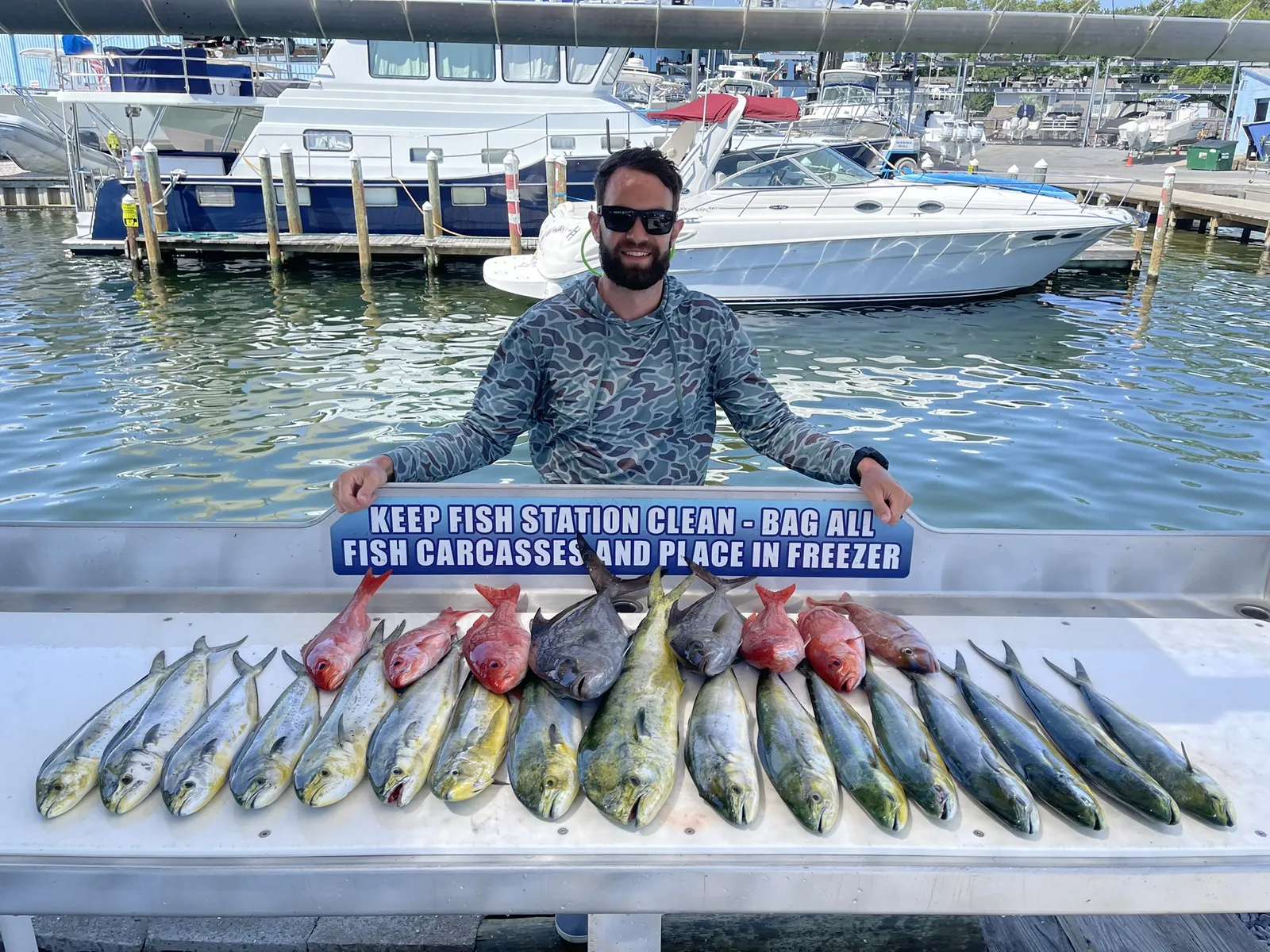 Fresh catch of the day laid out on the dock at Two Georges Marina in Shalimar