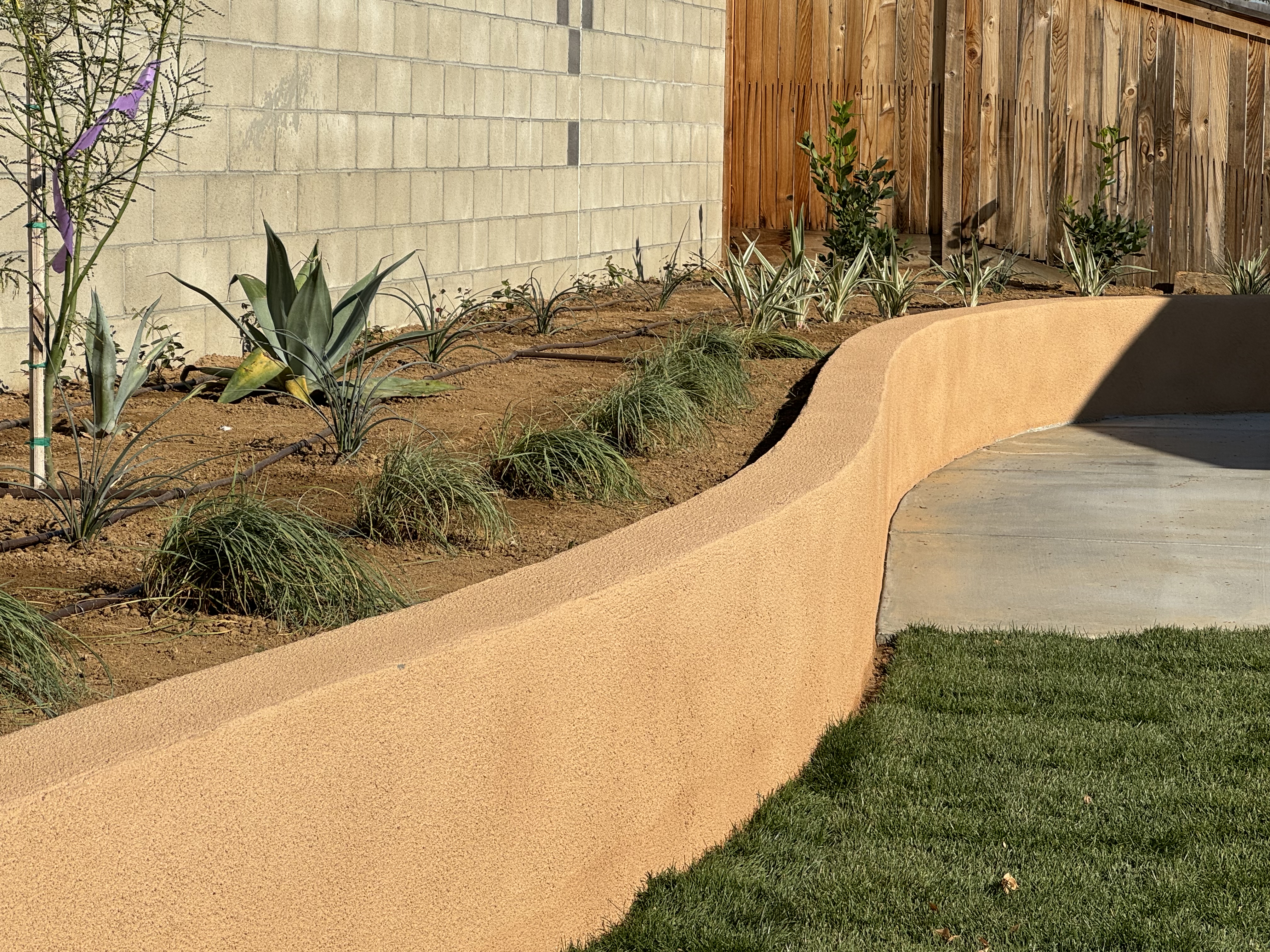 Artificial turf and low maintenance backyard landscaping in Bakersfield California