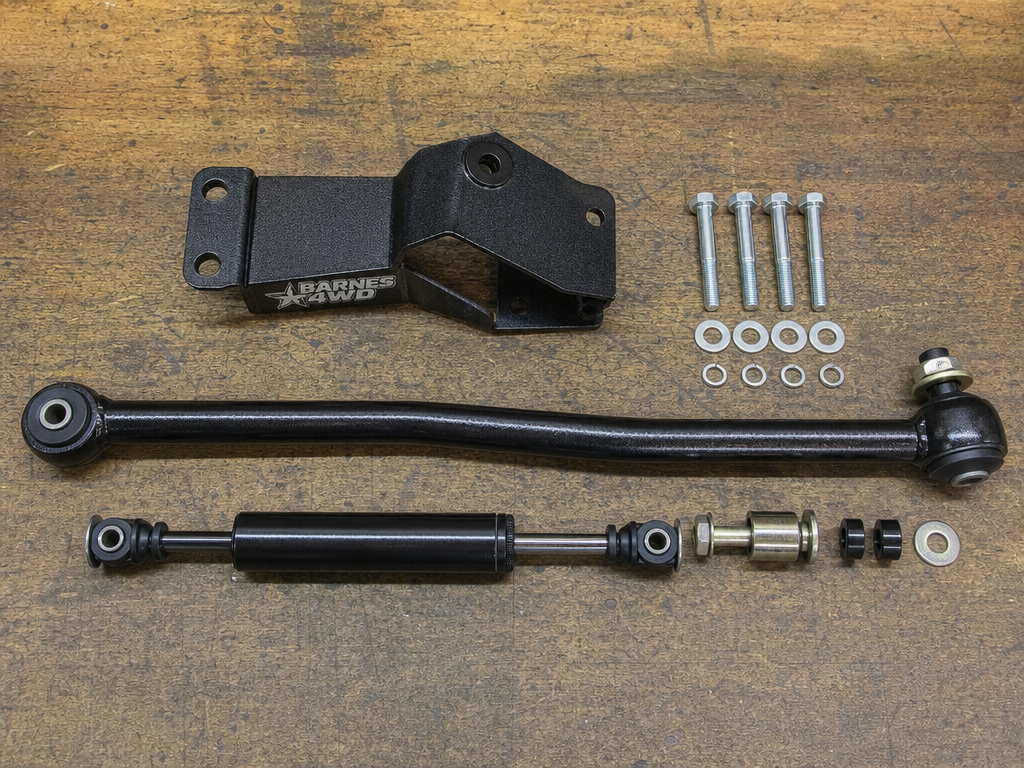 Jeep front suspension showing track bar drop bracket installation at Iron Ridge Off-Road Houston