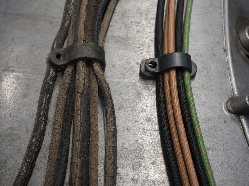 Cracked original wiring beside new reproduction harness