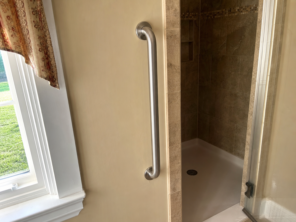 Grab bar installed beside a walk-in shower