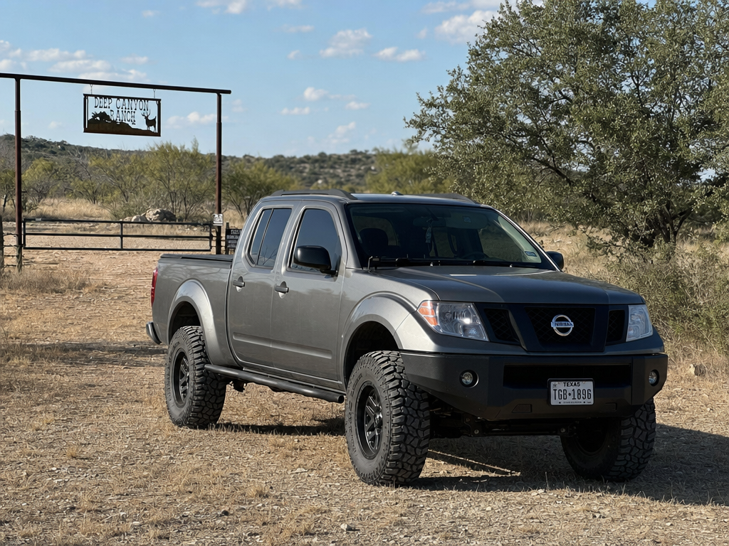 Lifted Nissan Frontier parked at a Texas hunting lease