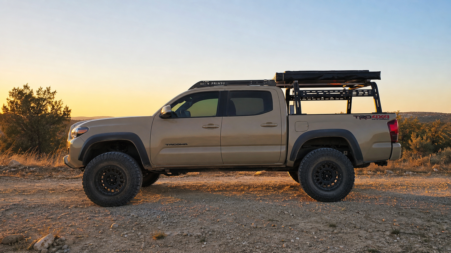 Project Redrock Toyota Tacoma side profile on Texas dirt road with Prinsu roof rack