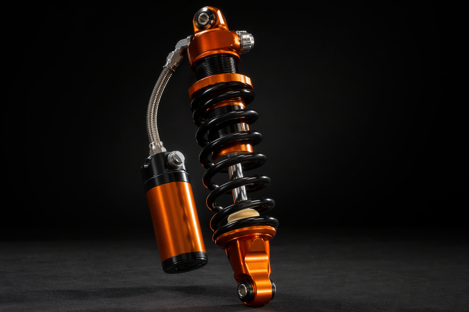 Fox 2.5 coilover shock absorber with orange body and reservoir