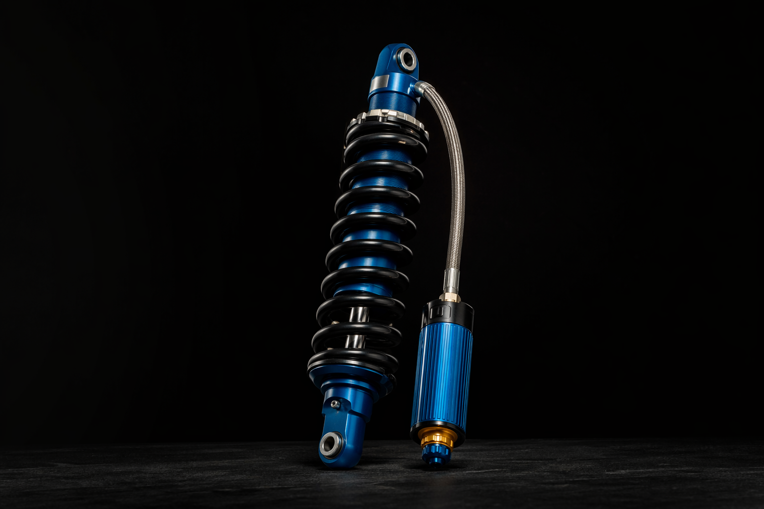 Icon coilover shock absorber with blue anodized body and reservoir