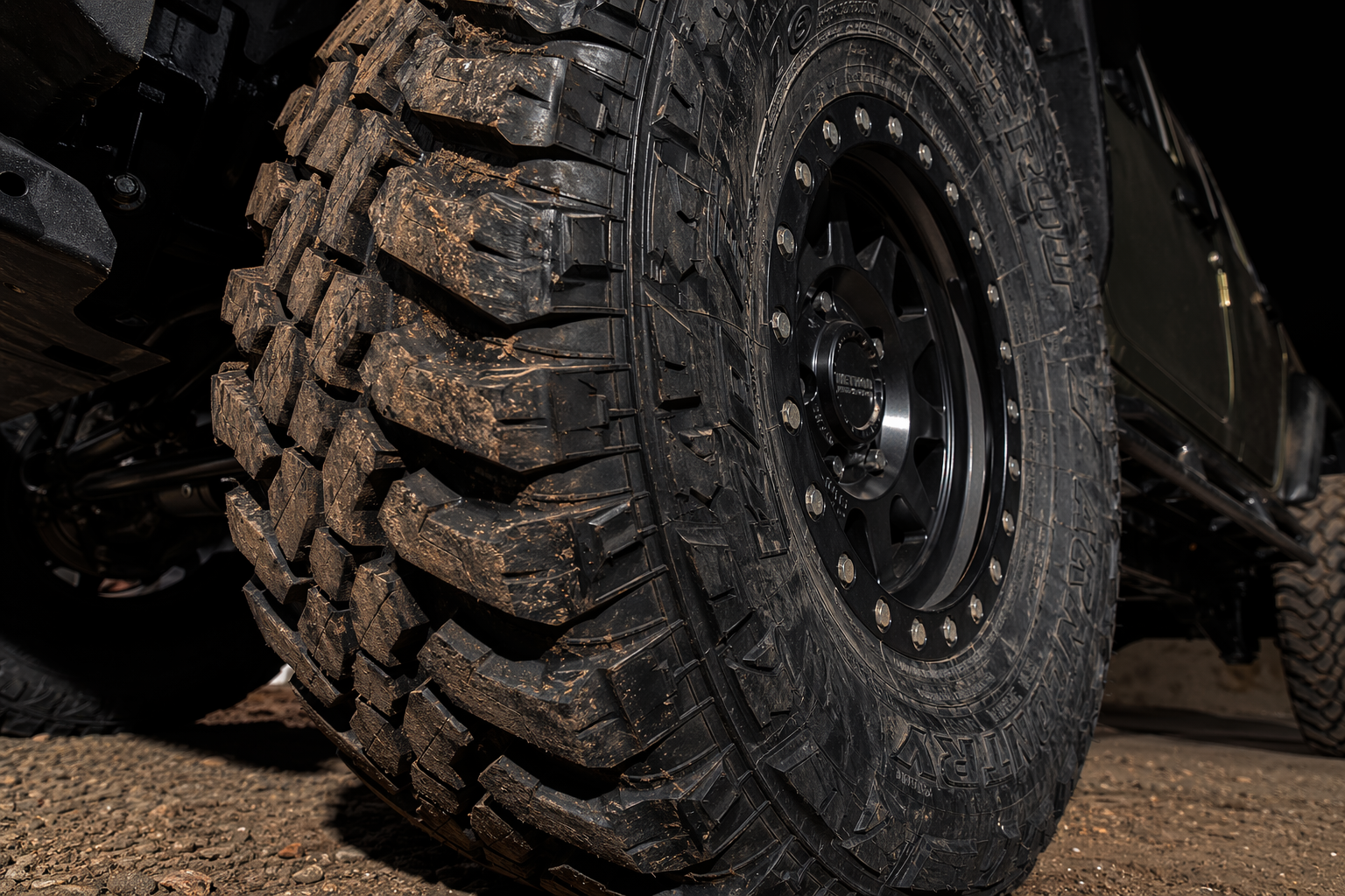 Aggressive mud terrain tire on beadlock wheel