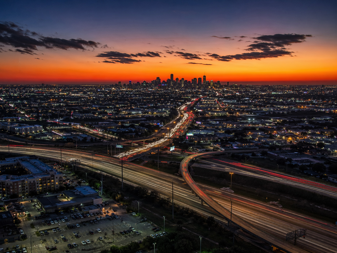 Houston Texas metro aerial view at dusk showing highway infrastructure