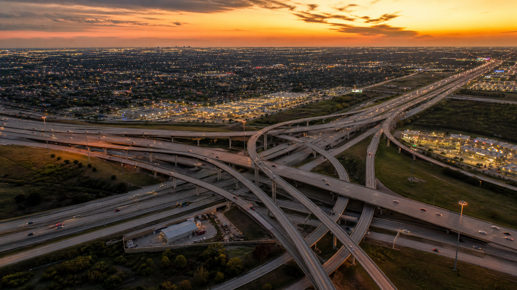 Houston Texas metro aerial view at dusk showing highway infrastructure