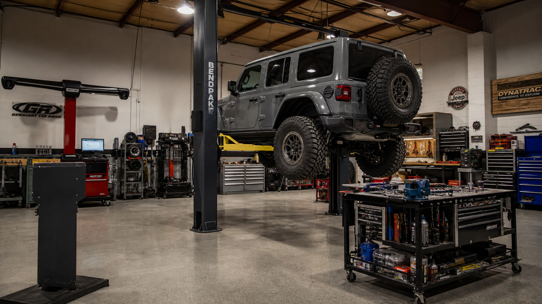 Jeep Wrangler JL on 4-post lift table full suspension disassembly