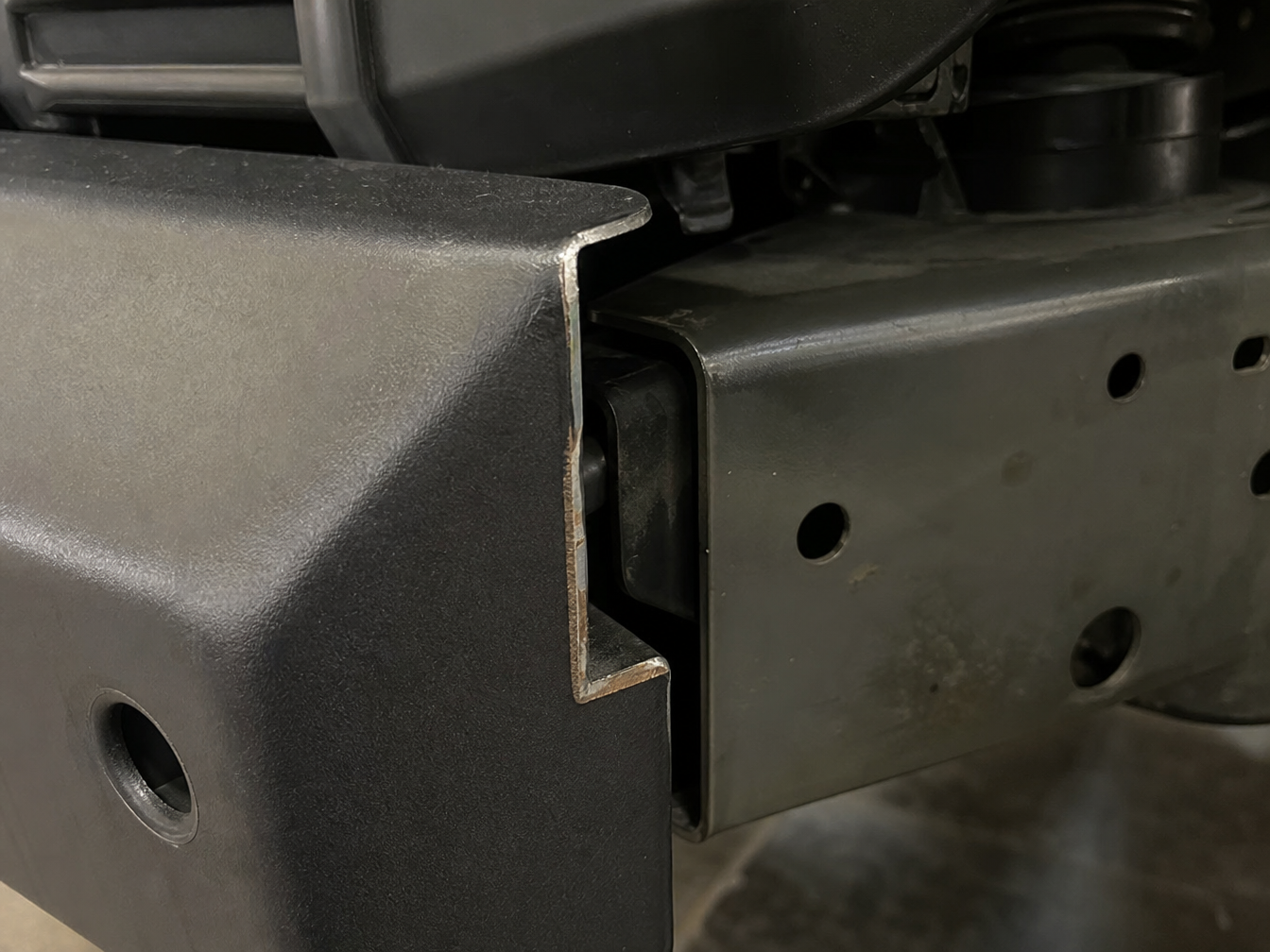 Incorrectly installed Jeep bumper with exposed wiring and improper recovery point mounting
