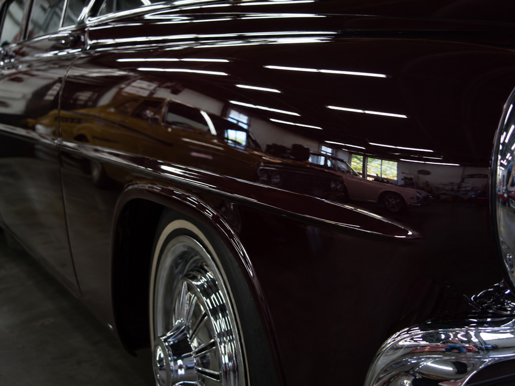 Show-quality buffed paint finish on a restored classic car panel