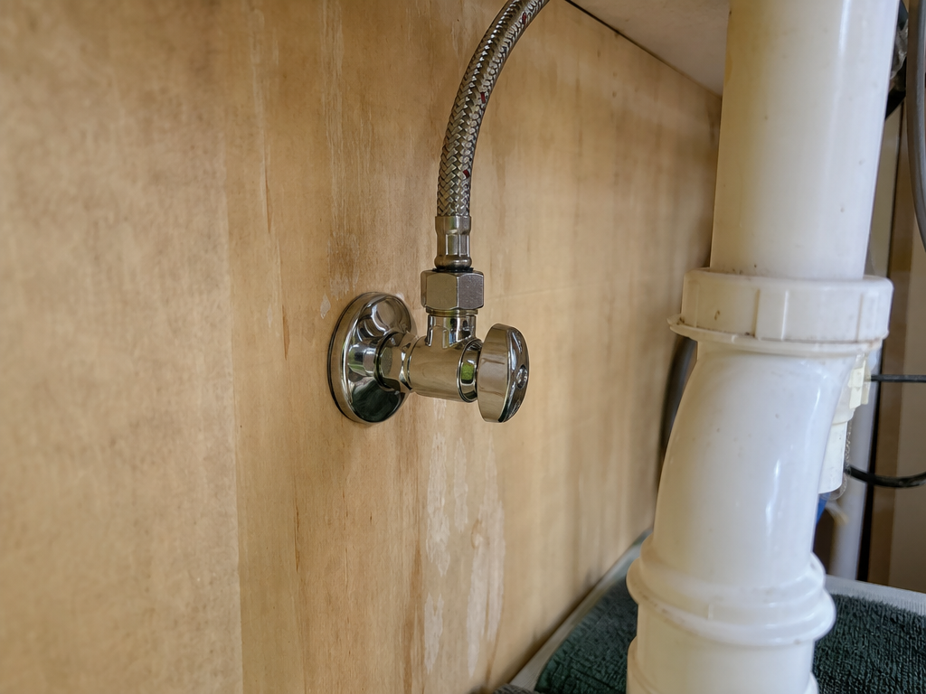 New quarter-turn shutoff and braided supply line under a sink