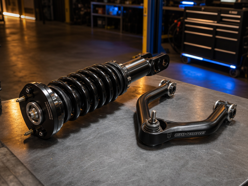 Ford Ranger front suspension on a shop hoist with coilover and control arm visible