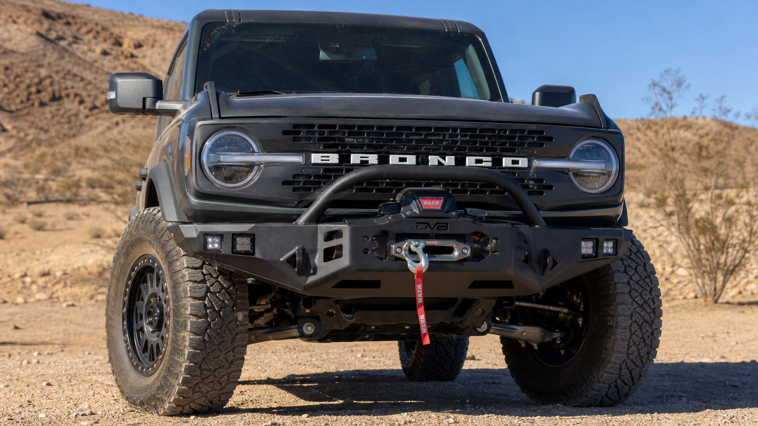Project Iron Mesa Ford Bronco front build shot showing DV8 bumper and Warn winch