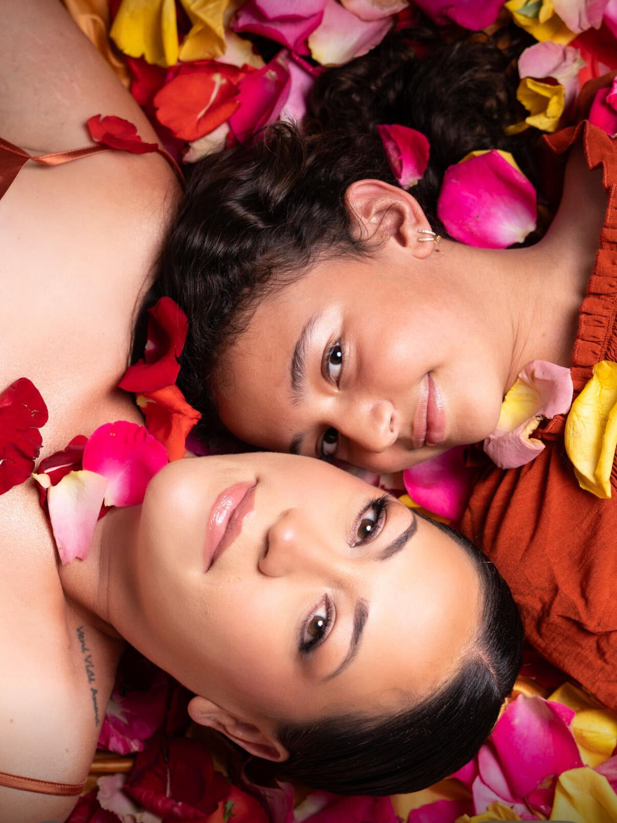 Carmen Rosas and her daughter, surrounded by rose petals
