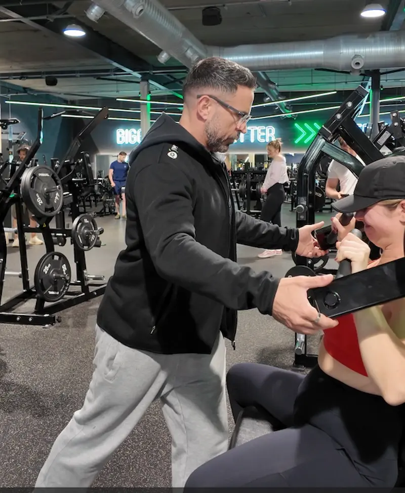 Paul Butler coaching a client on the gym floor at JD Gyms Bitterne, Southampton