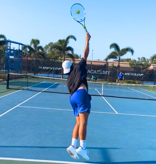 Junior tennis player serving during technical growth training at Zenniq Academy in Katy Texas