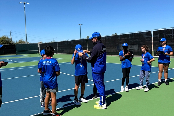 Zenniq Academy coach guiding junior tennis players during summer camp in Katy Texas