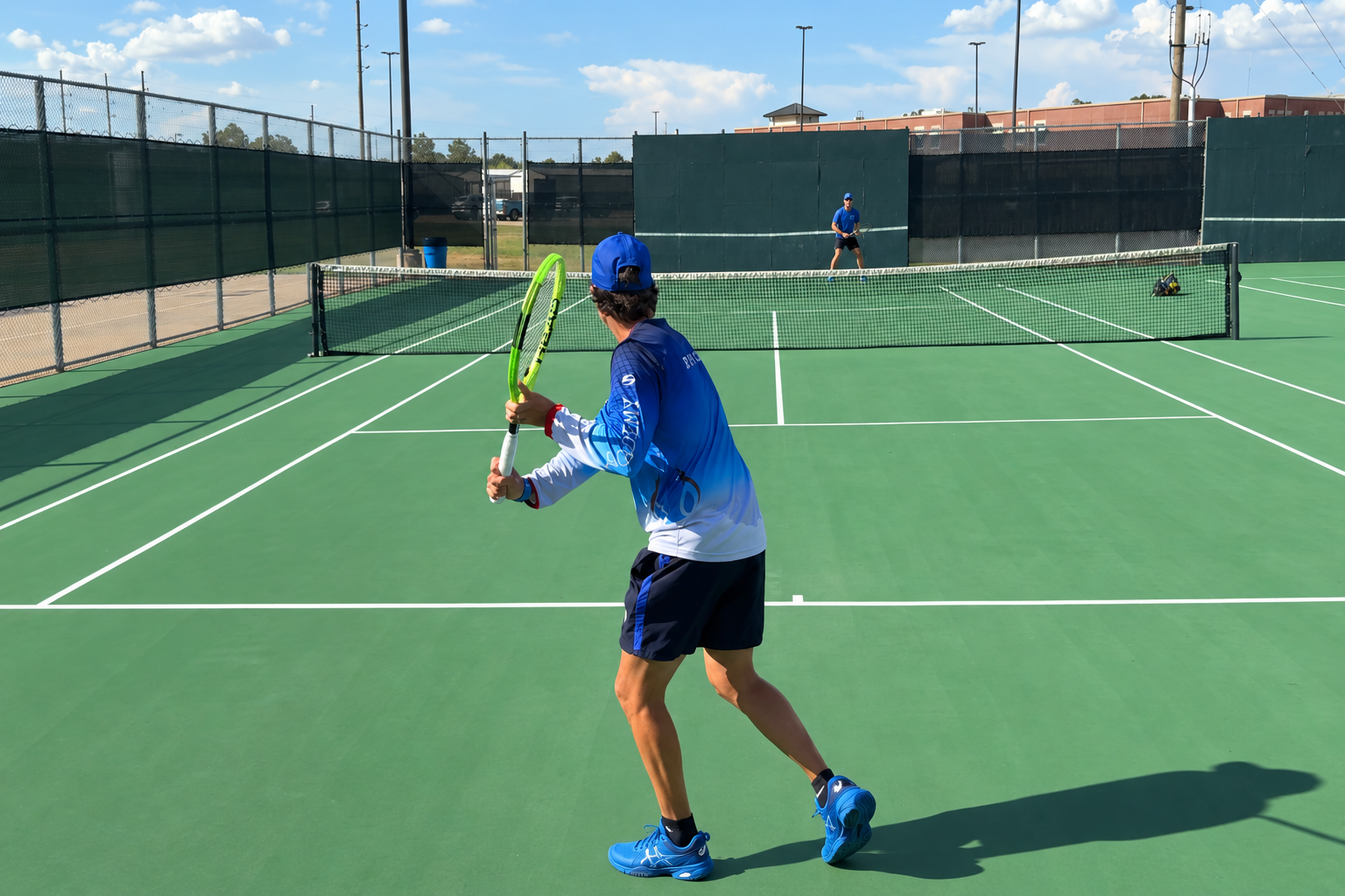 Adult tennis player preparing a one-handed backhand at ZENNIQ Academy in Katy, Texas