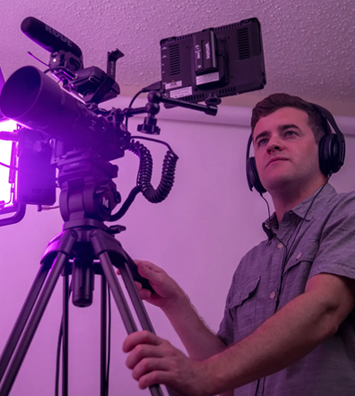 Blake filming with a cinema camera