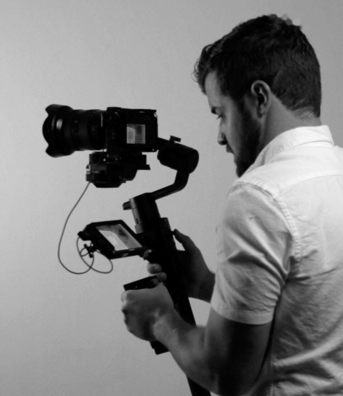 Blake Hickey filming with a cinema camera on a gimbal