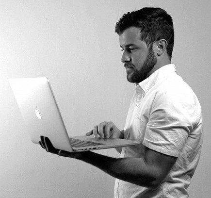 Blake Hickey working on a laptop