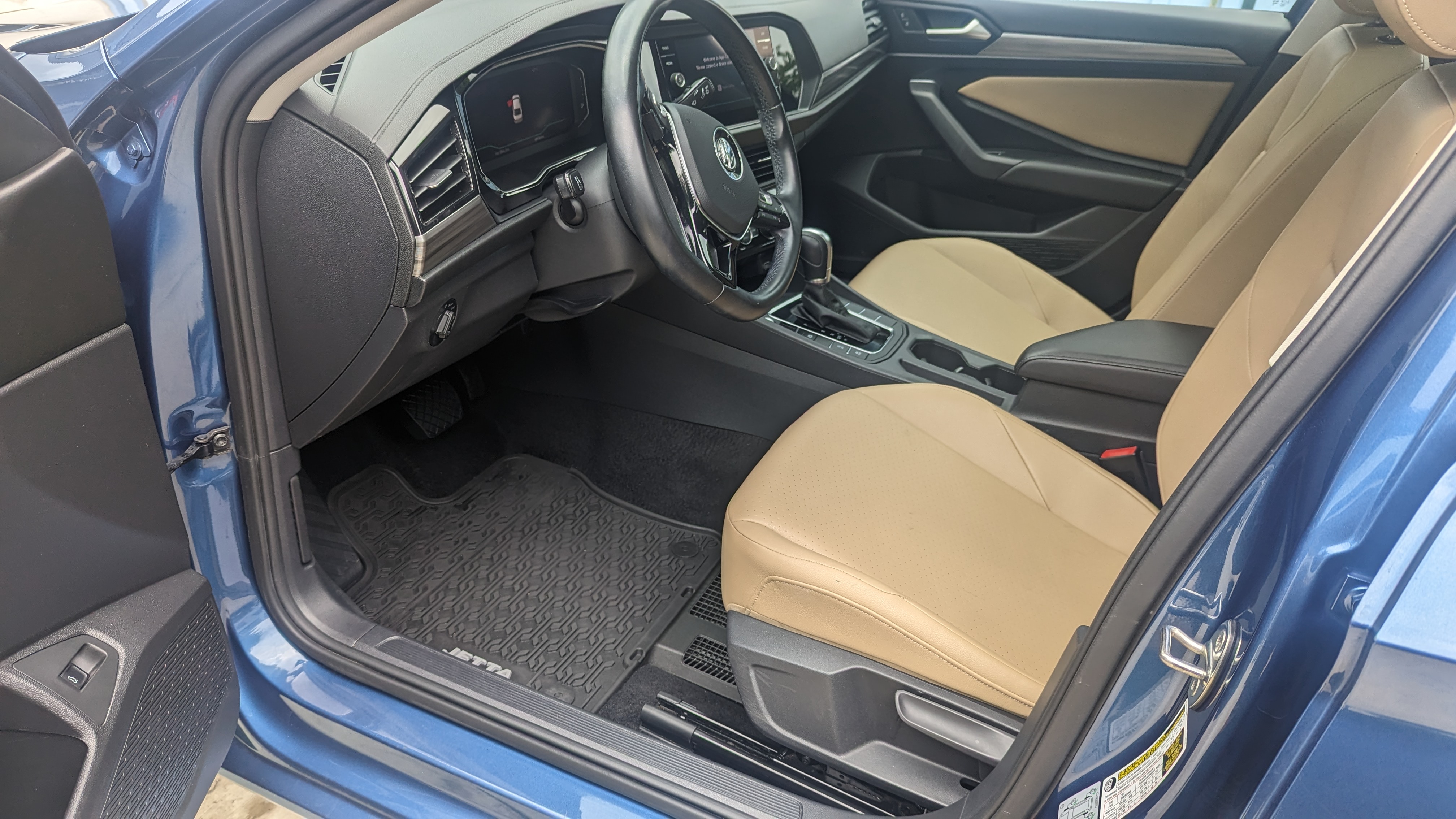 VW Jetta interior after deep detail — clean seats and floor restored