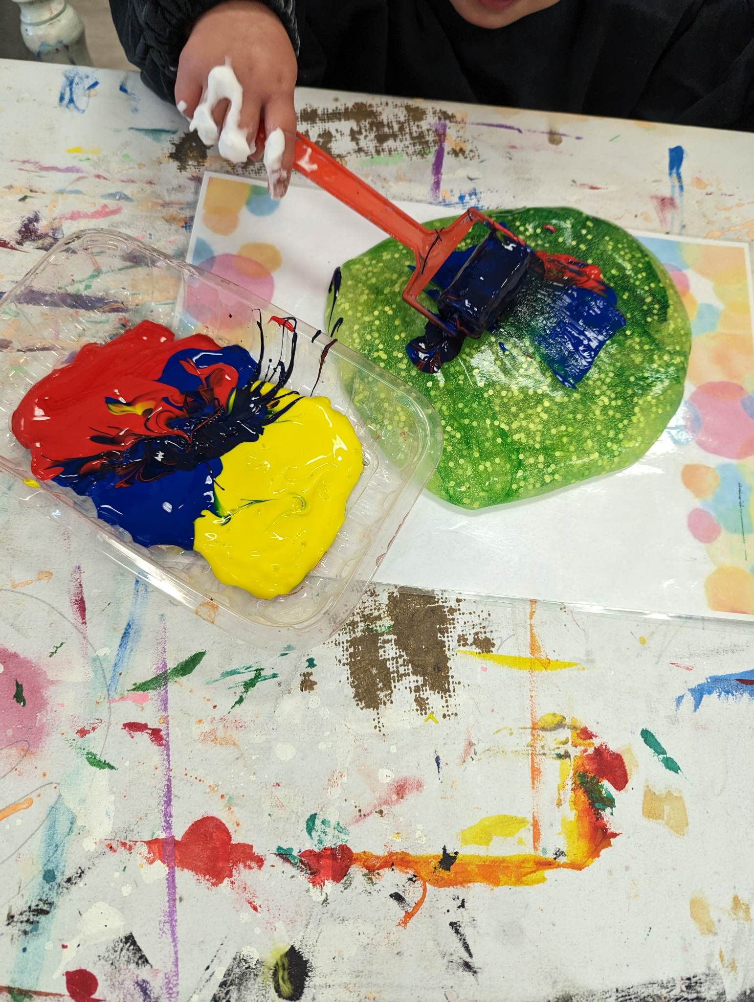 Child exploring art materials at Creative Makes studio, Hastings Child exploring art materials at Creative Makes studio, Hastings