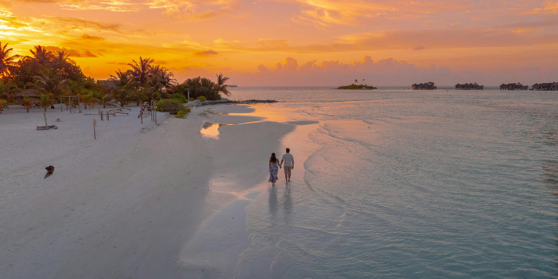 Couple walking on the beach
