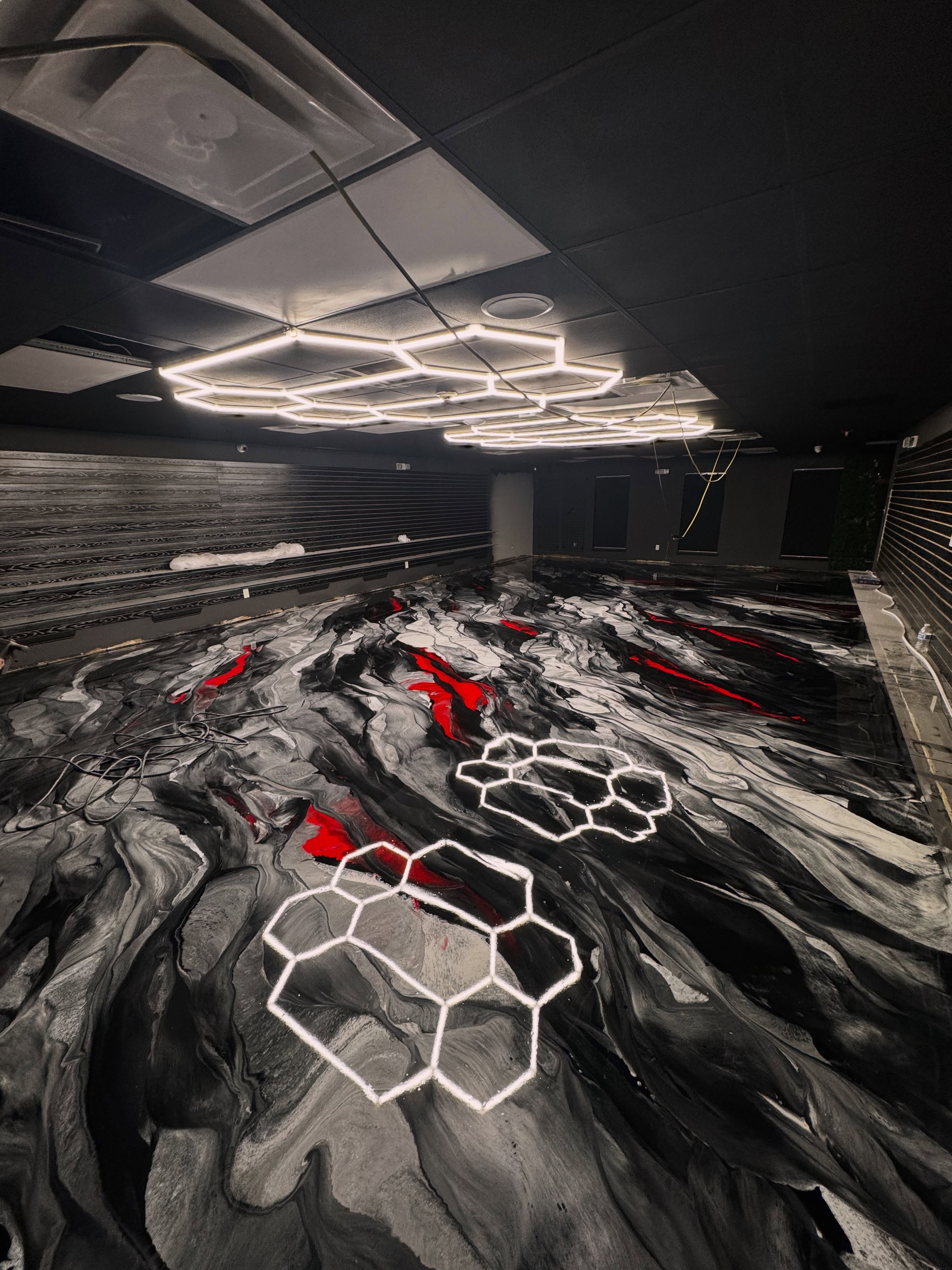 Red, black & silver metallic epoxy flooring installed by ORIX
