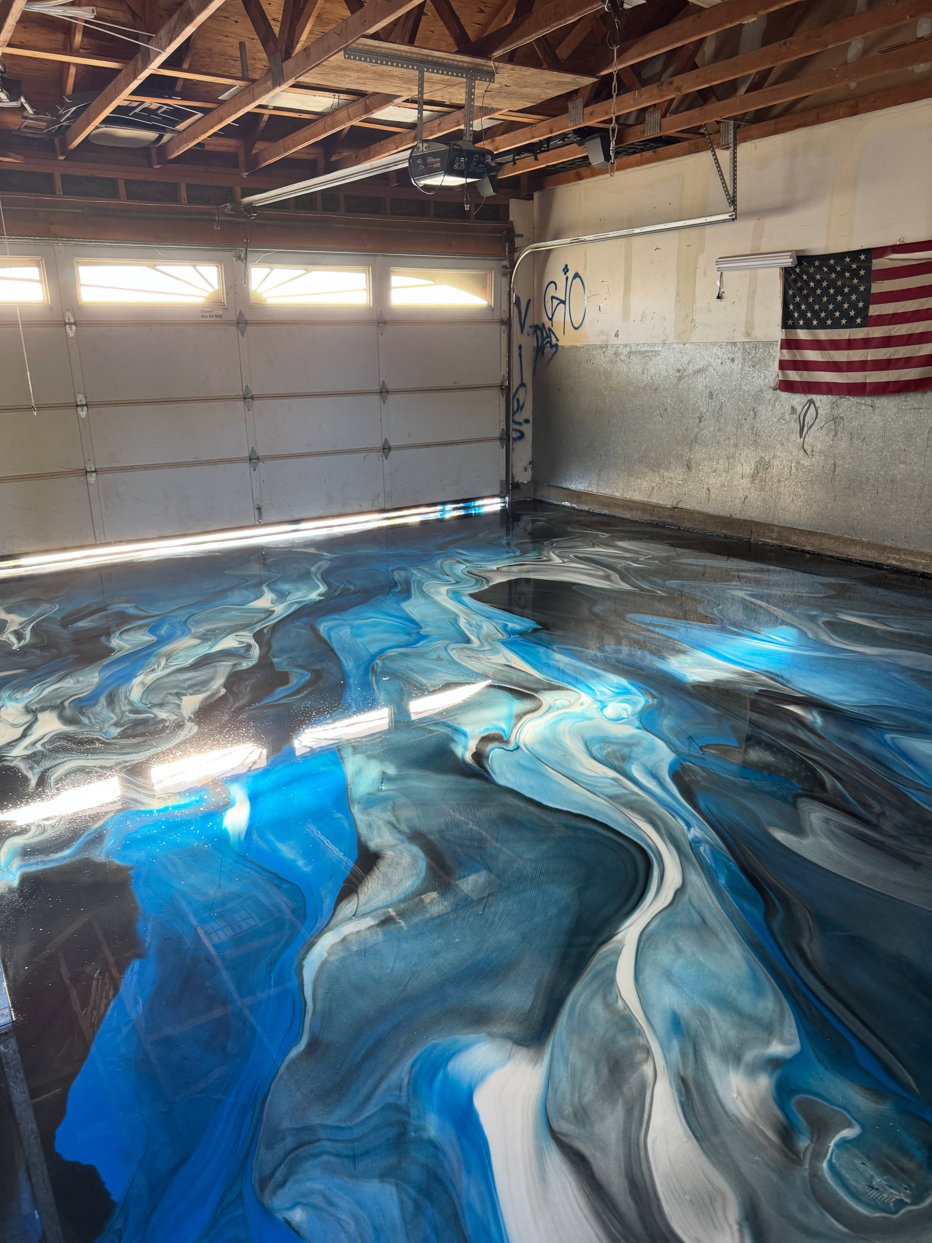 Blue & silver metallic epoxy flooring installed by ORIX