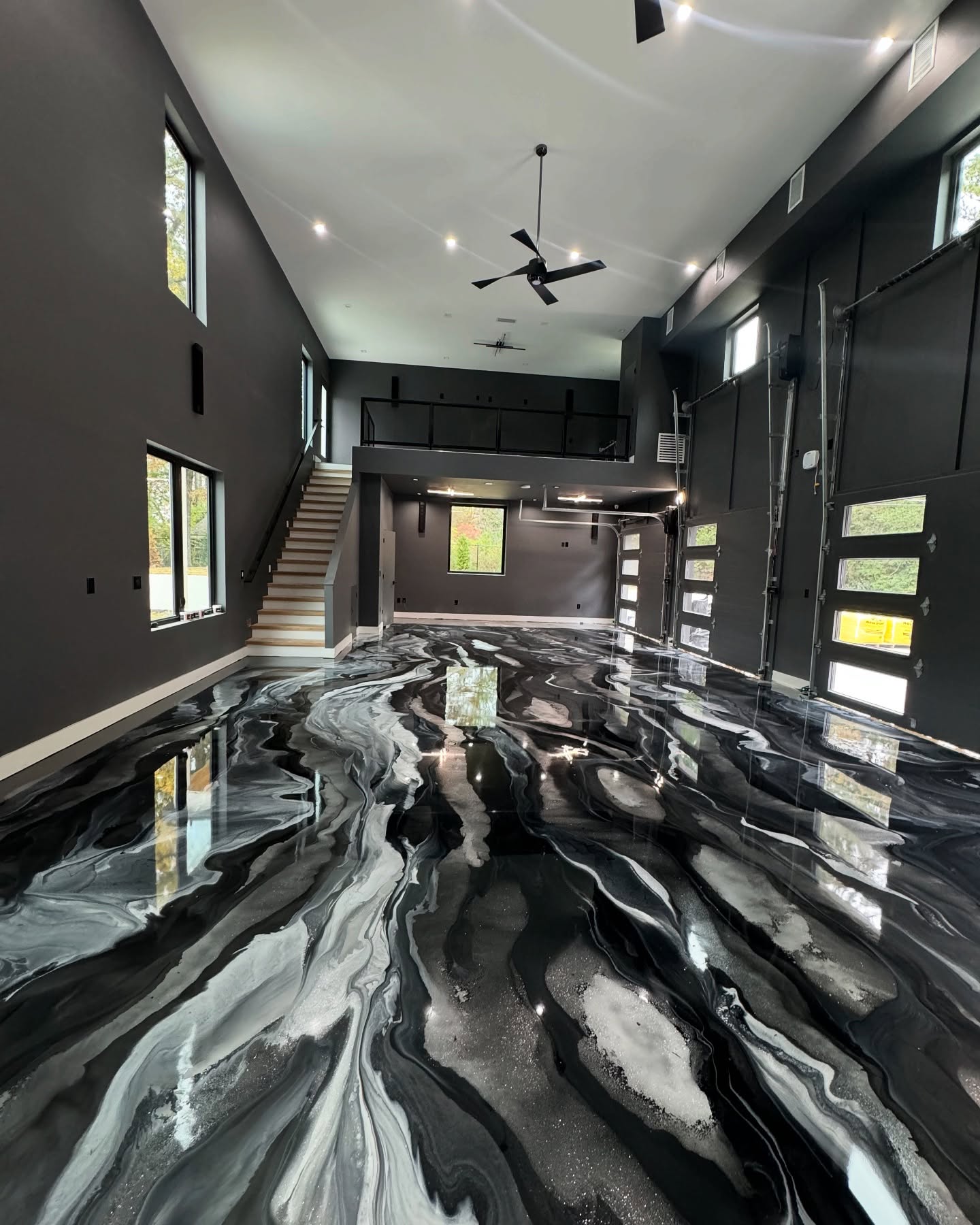 Black & white metallic epoxy flooring installed by ORIX