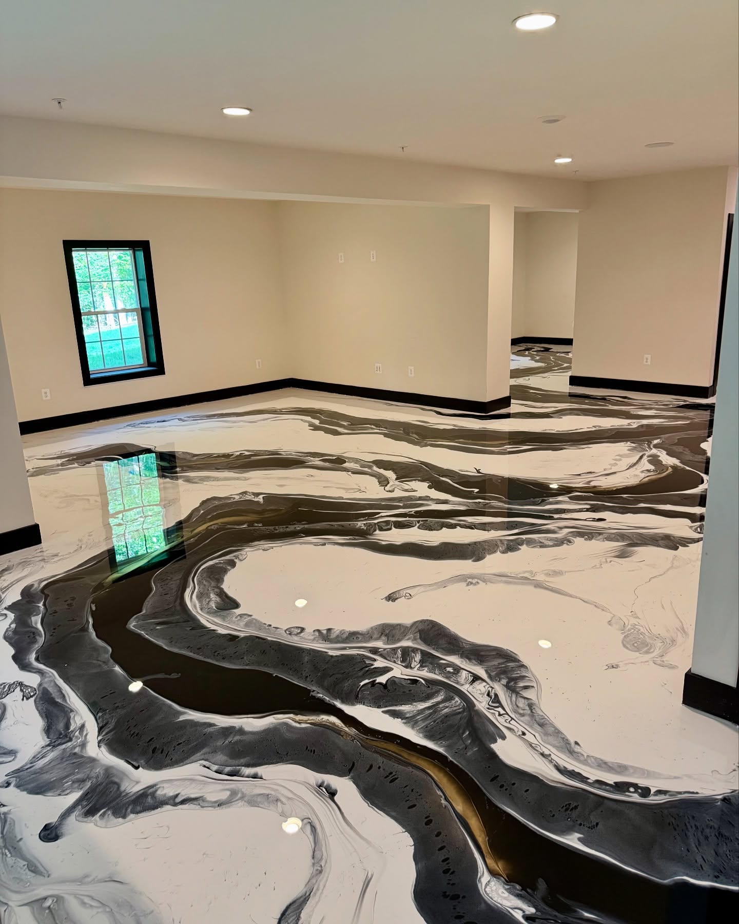 White & charcoal metallic epoxy flooring installed by ORIX