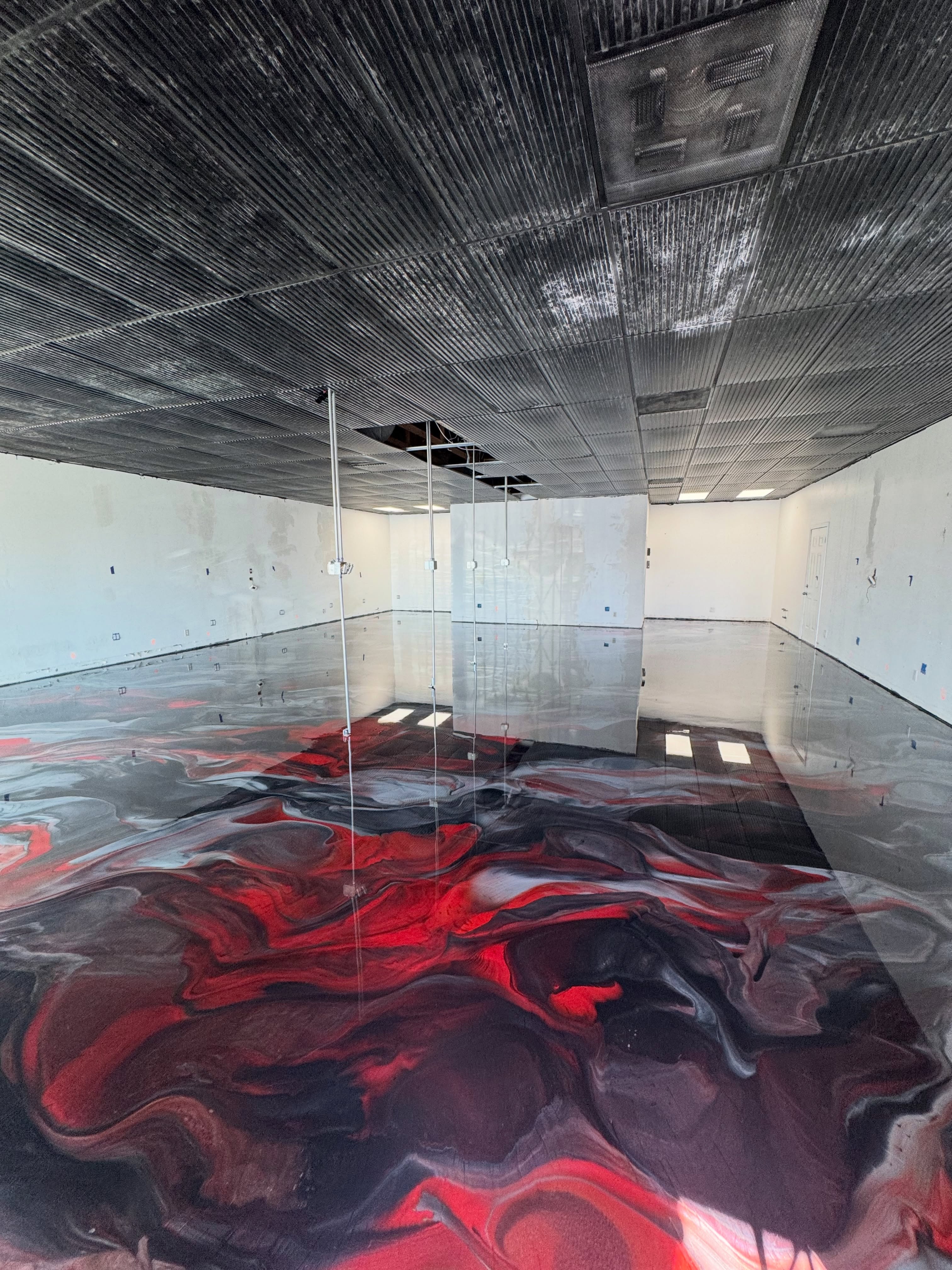 Red & charcoal metallic epoxy flooring installed by ORIX