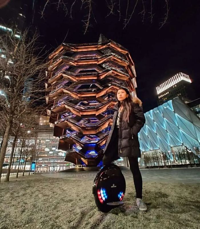 Rose Song Wang with her electric unicycle at the Vessel, Hudson Yards, New York