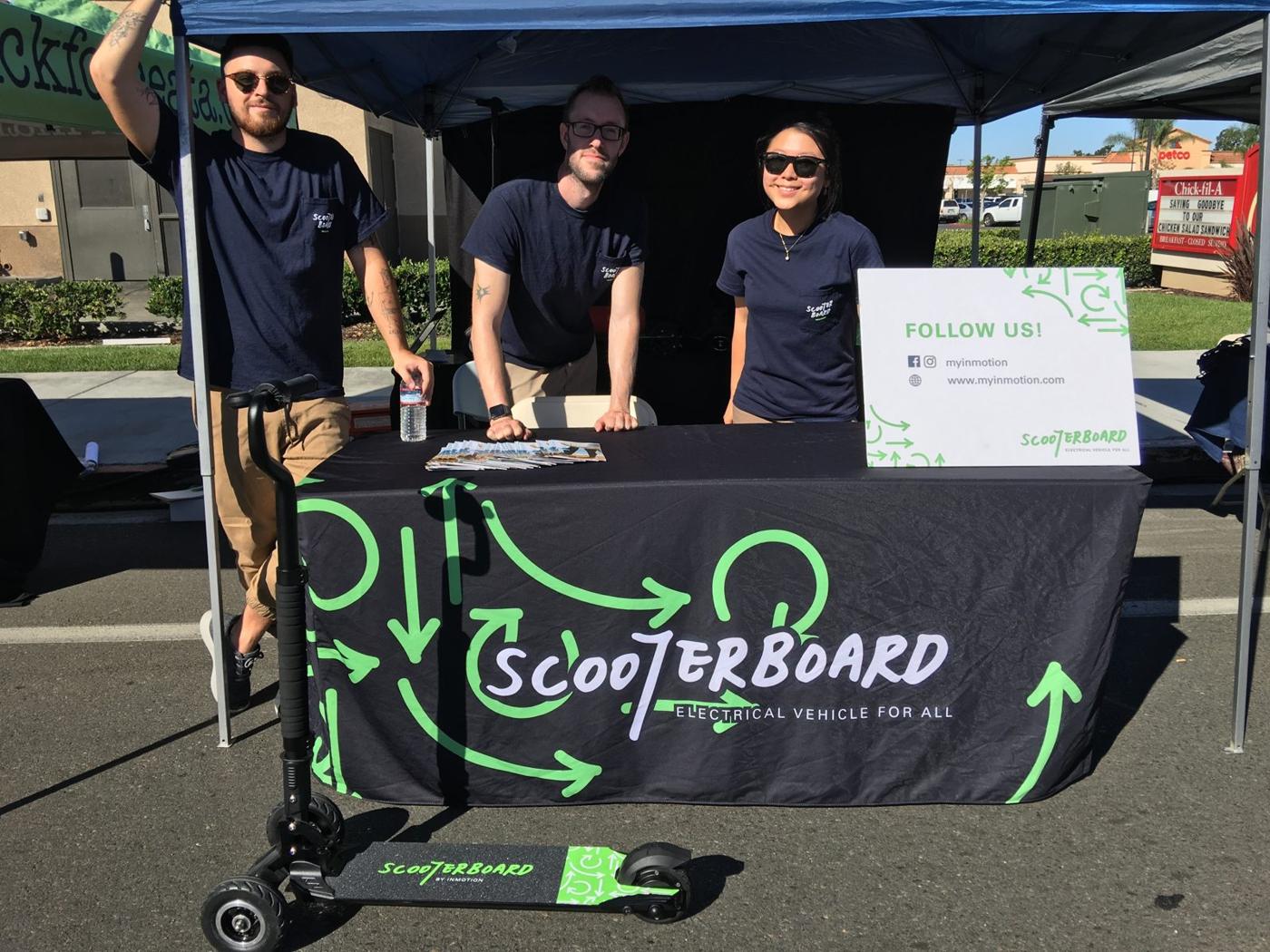 Bilingual team staffing the Scooterboard booth