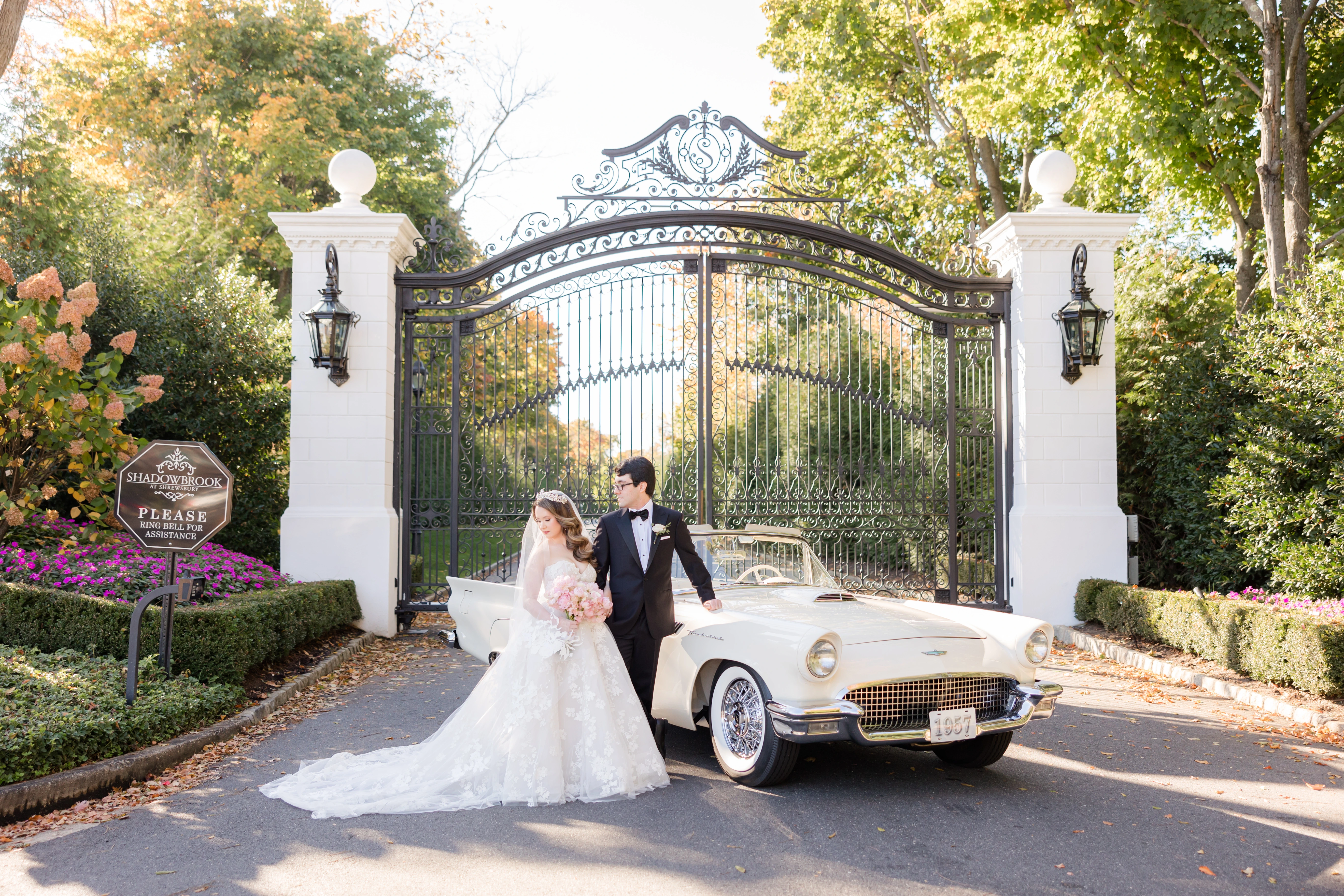 Couple at wrought-iron estate gate