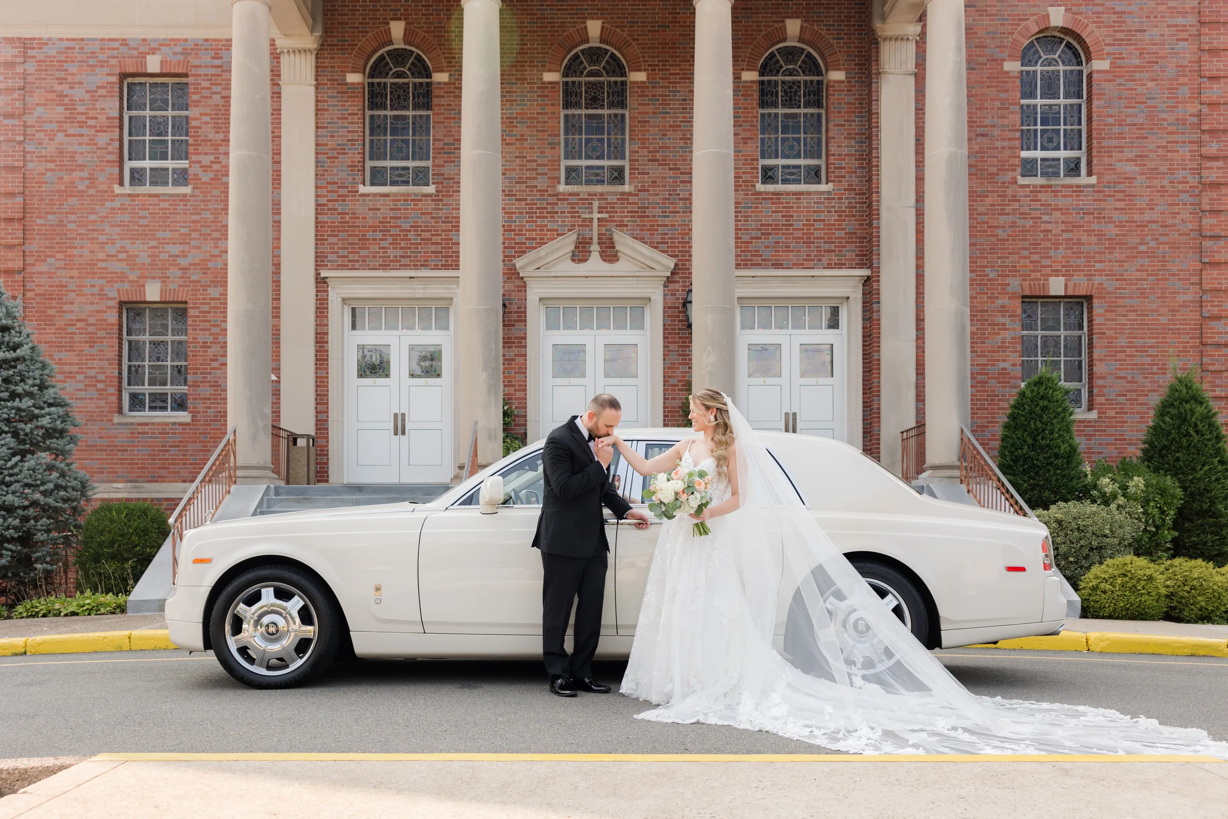 Mary and Keith — bride at the stone arch with the car