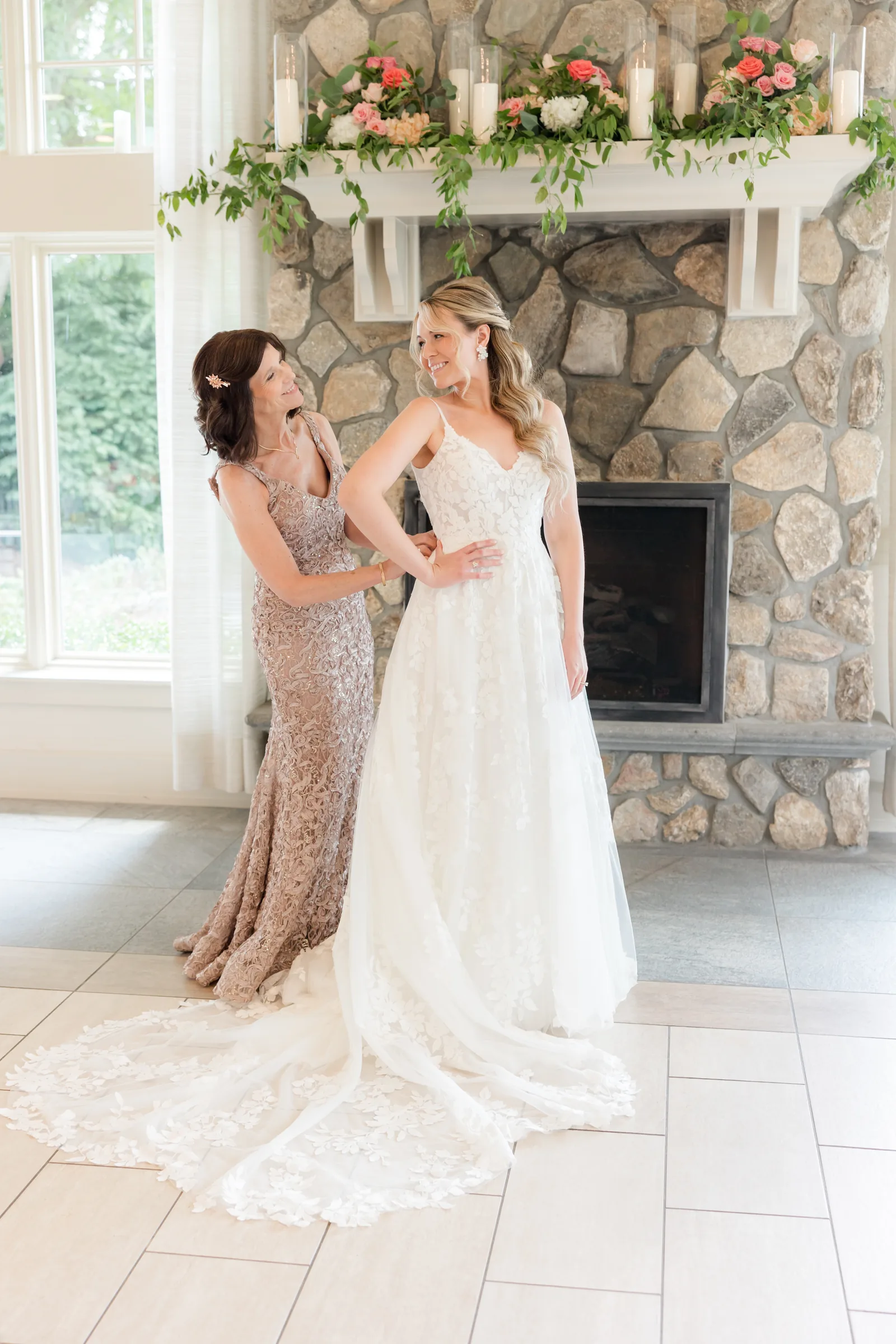 Mary and Keith — bride with sister at the fireplace