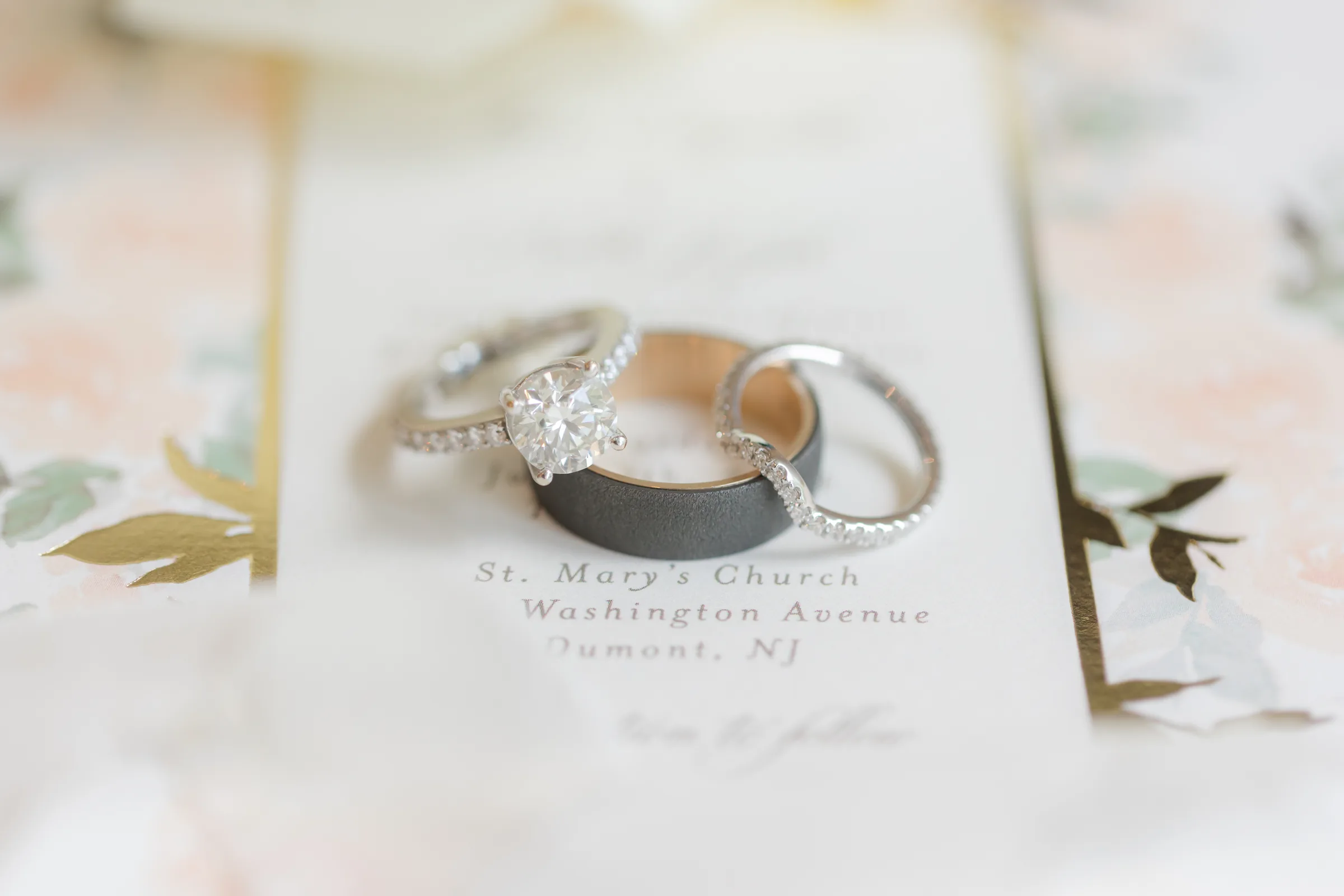 Mary and Keith — wedding rings on the book
