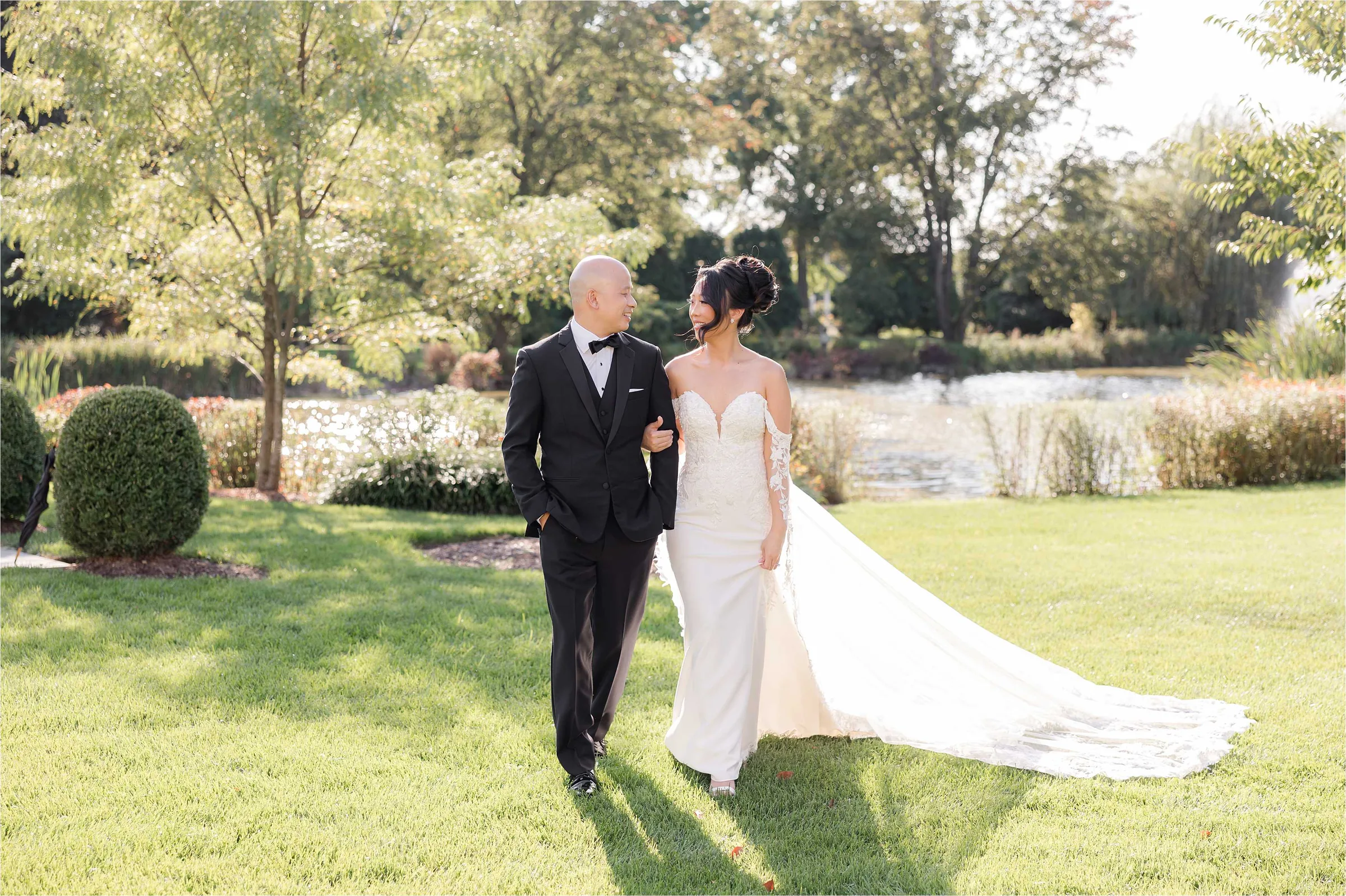 Stephanie and Cliff — bride alone on the floral staircase