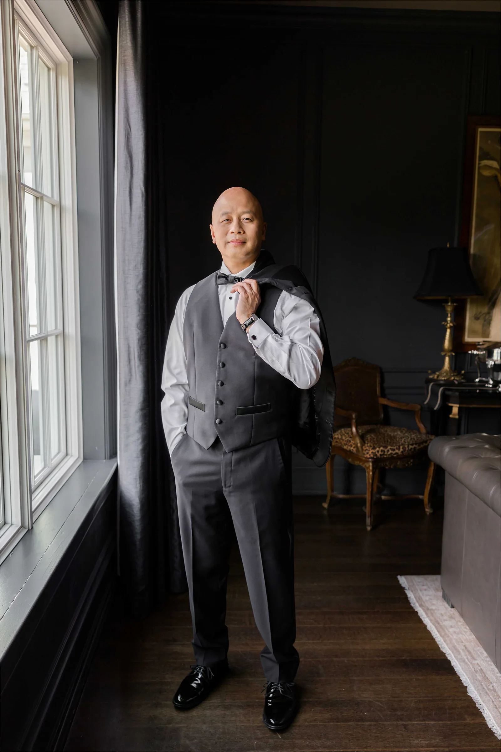 Stephanie and Cliff — groom solo in dark interior