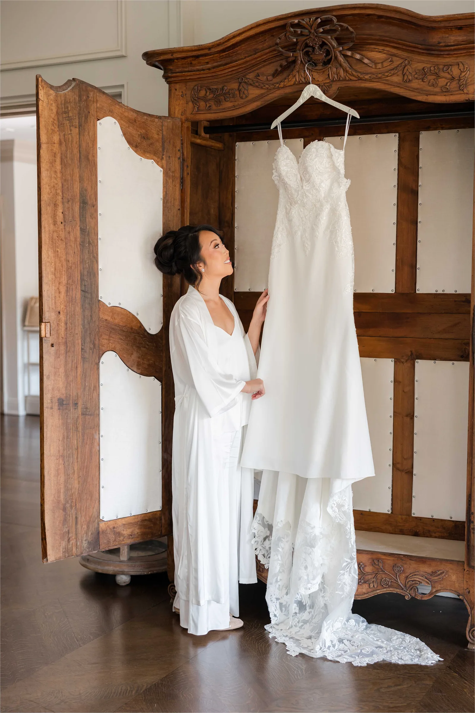 Stephanie and Cliff — bride trying on the gown