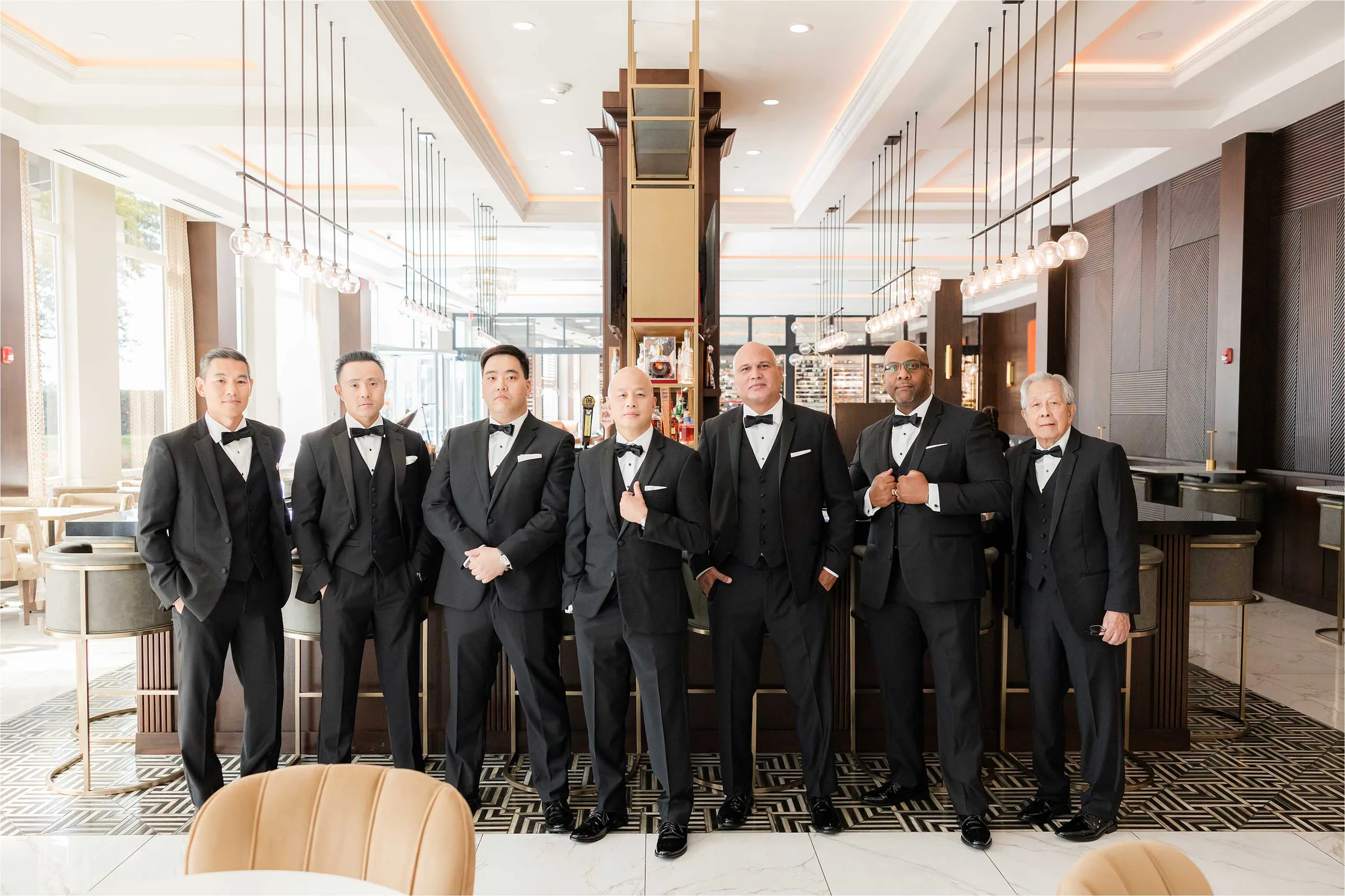 Stephanie and Cliff — groomsmen at the bar