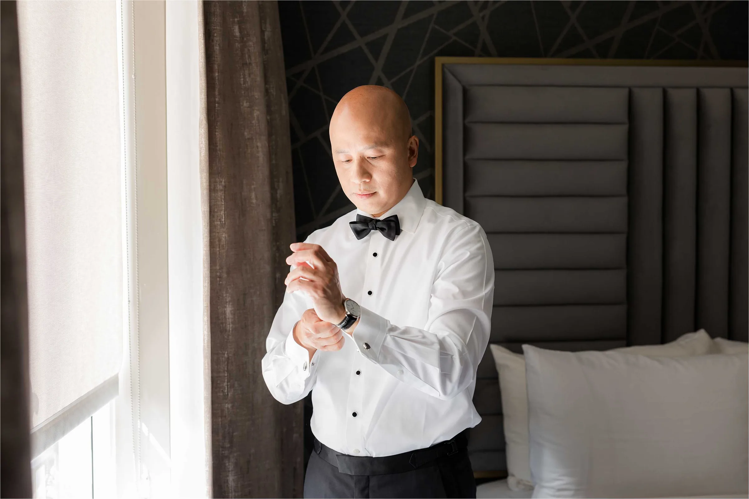 Stephanie and Cliff — groom prep, tying the bow tie